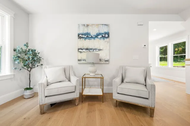 a view of living room with furniture fireplace and window