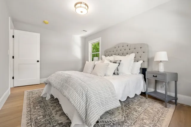 a bathroom with a double vanity sink mirror double and a bathtub