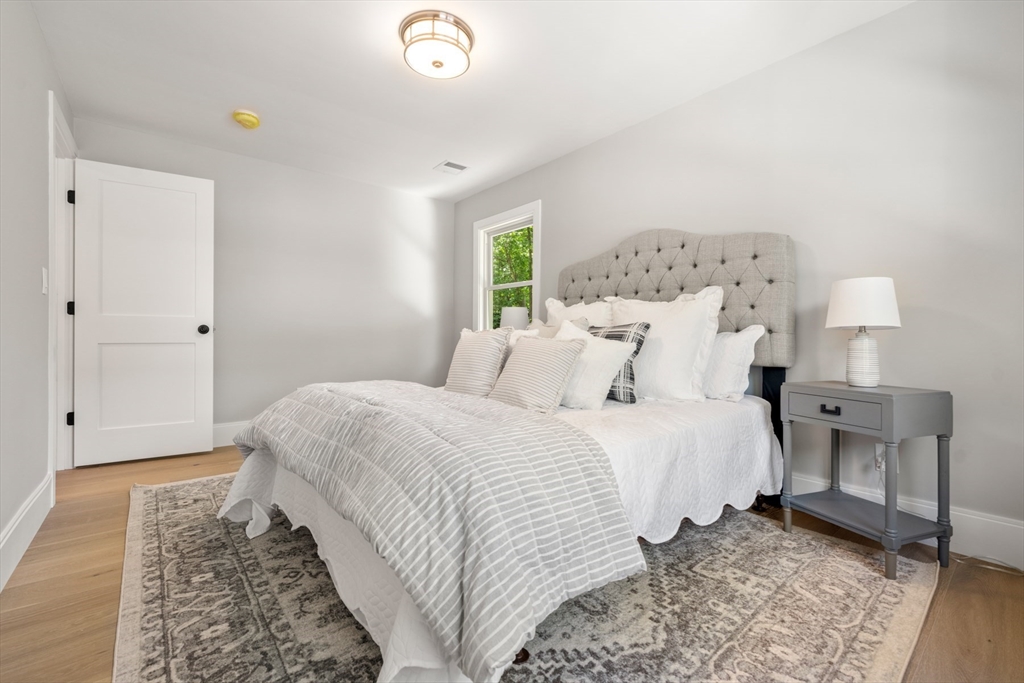 2 Rockwood Road Natick, MA 01760 - Photo 18 of 37 a bedroom with a bed and a window