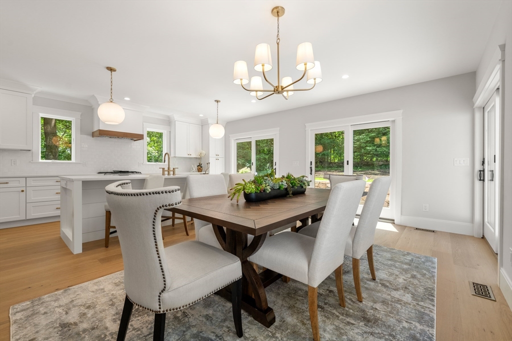 2 Rockwood Road Natick, MA 01760 - Photo 2 of 37 a view of a dining room with furniture a chandelier and wooden floor