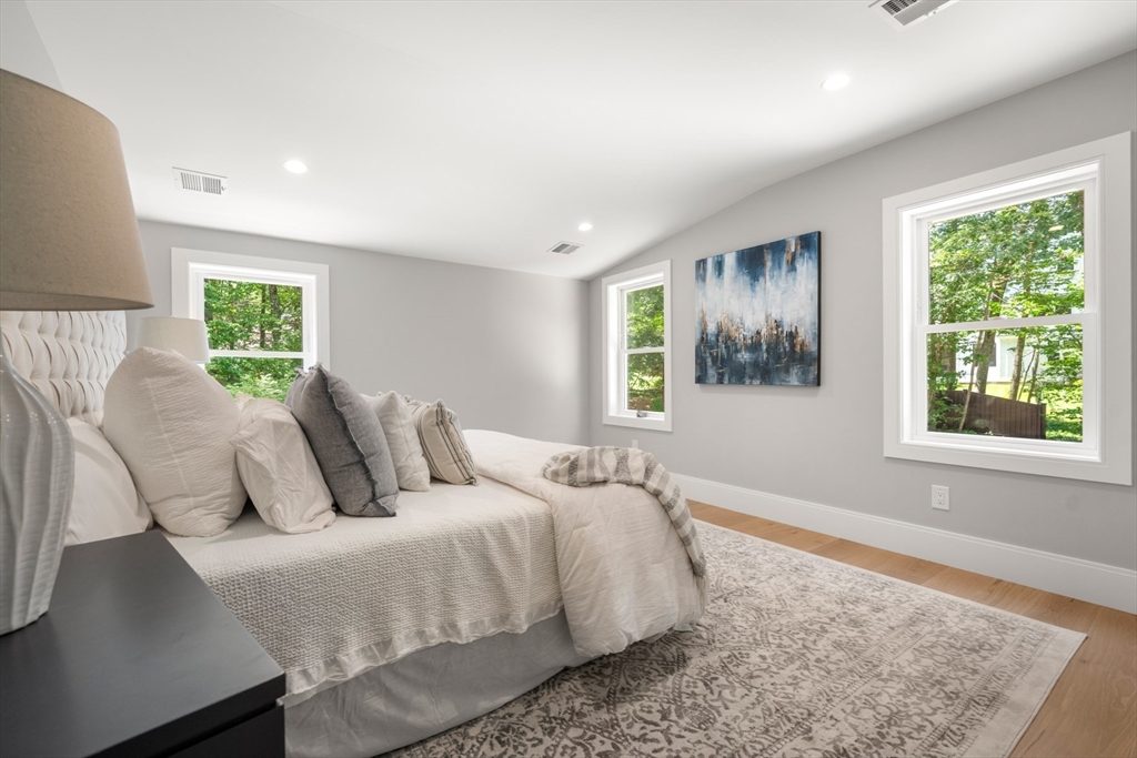 2 Rockwood Road Natick, MA 01760 - Photo 22 of 37 a bedroom with a bed and a window