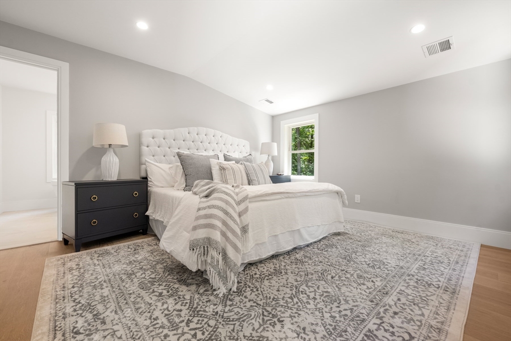 2 Rockwood Road Natick, MA 01760 - Photo 23 of 37 a bedroom with a bed and a window