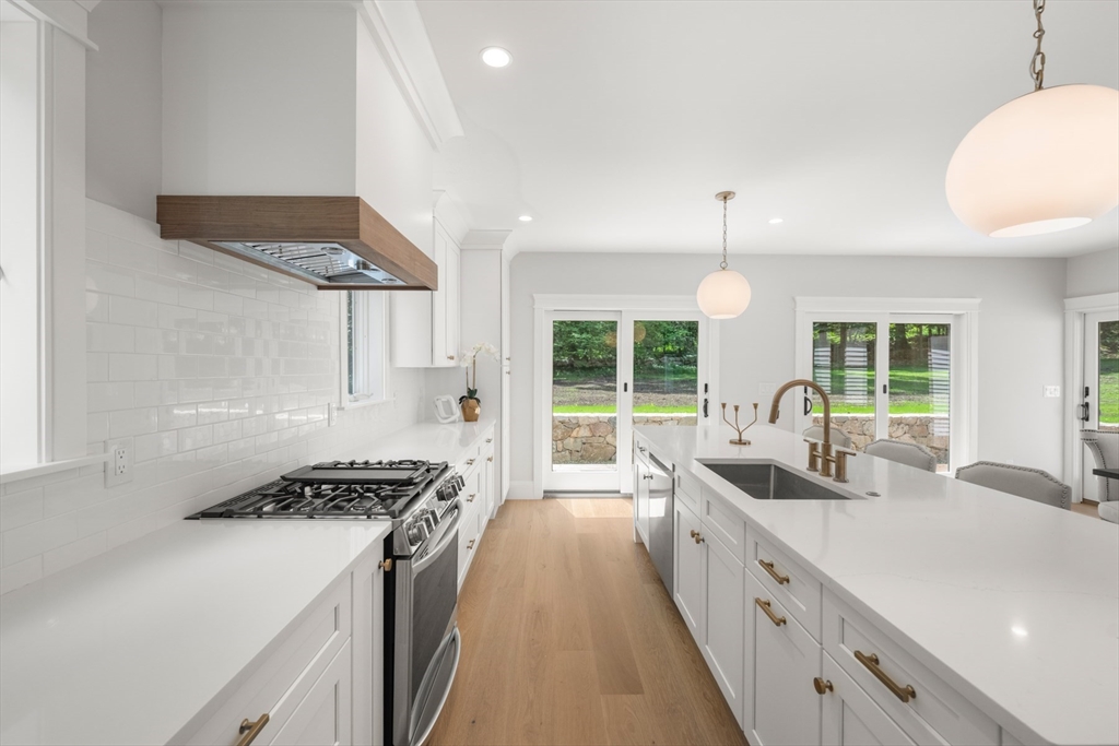 2 Rockwood Road Natick, MA 01760 - Photo 5 of 37 a kitchen with stainless steel appliances a sink a stove a refrigerator and cabinets
