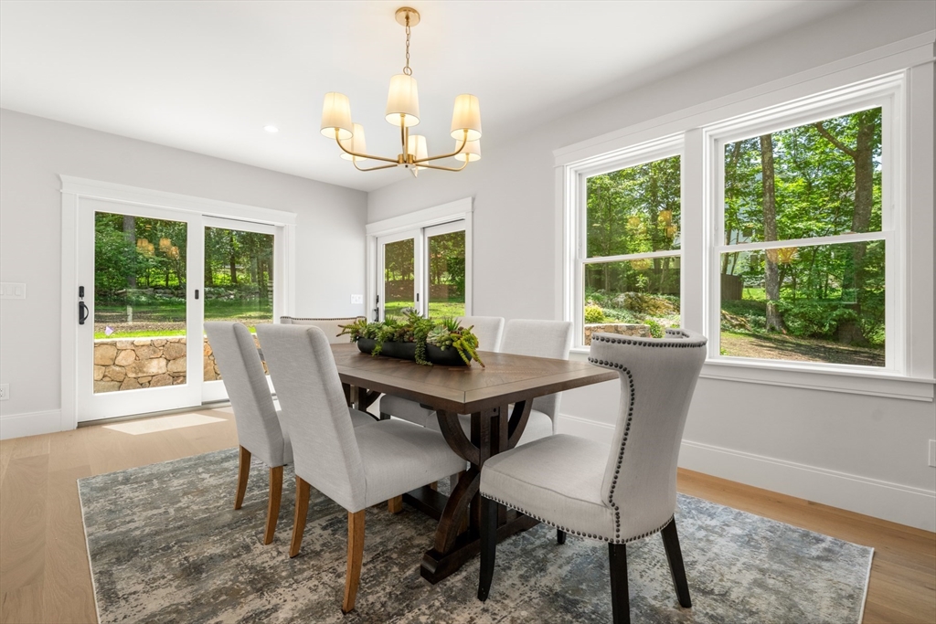 2 Rockwood Road Natick, MA 01760 - Photo 8 of 37 a view of a dining room with furniture a chandelier and wooden floor