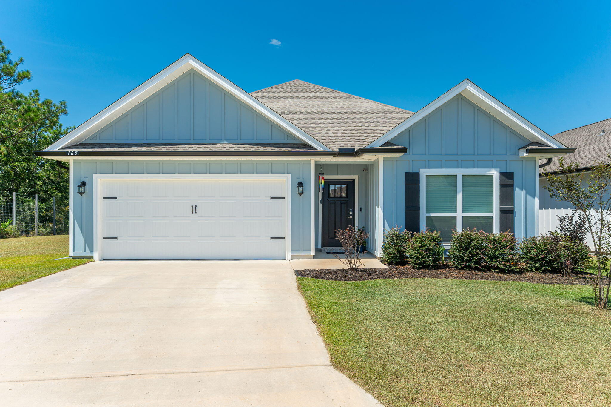 165 Blooming Cove Crestview, FL 32539 - Photo 1 of 44 a front view of a house with a yard and garage