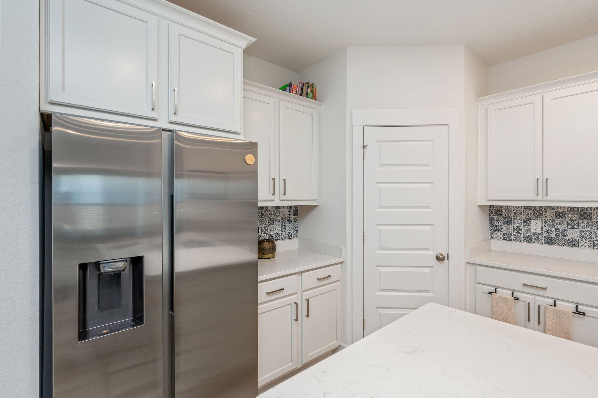 165 Blooming Cove Crestview, FL 32539 - Photo 15 of 44 a kitchen with cabinets and a refrigerator