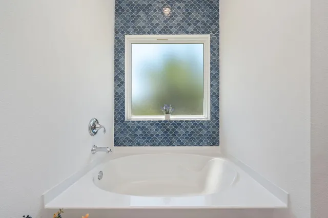 a bathroom with a bathtub