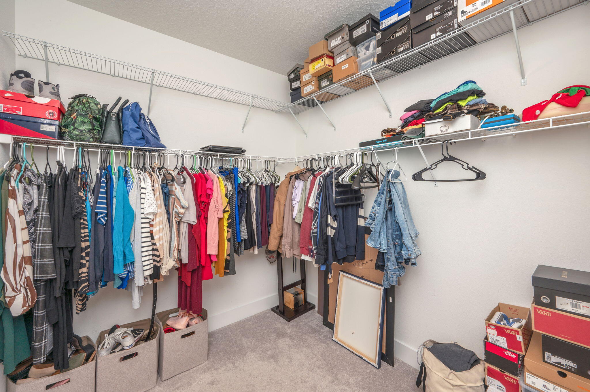 165 Blooming Cove Crestview, FL 32539 - Photo 26 of 44 a view of walk in closet with clothes and shoes