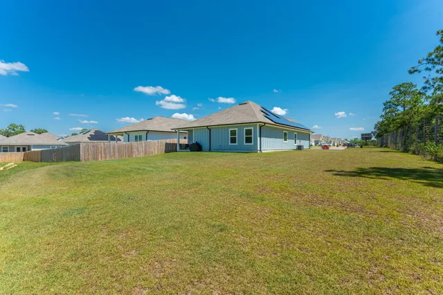 a view of a house with a big yard