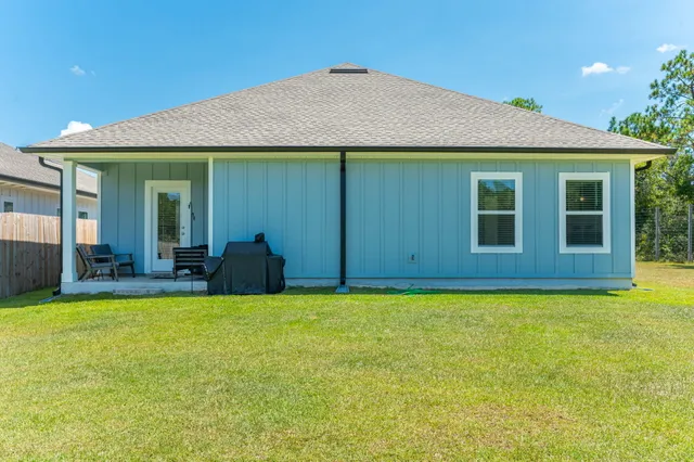 a view of a house with swimming pool and porch