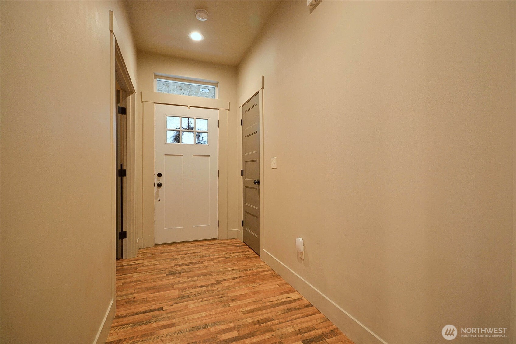 259 Parkside Loop Chehalis, WA 98532 - Photo 7 of 39 a view of a hallway with wooden floor
