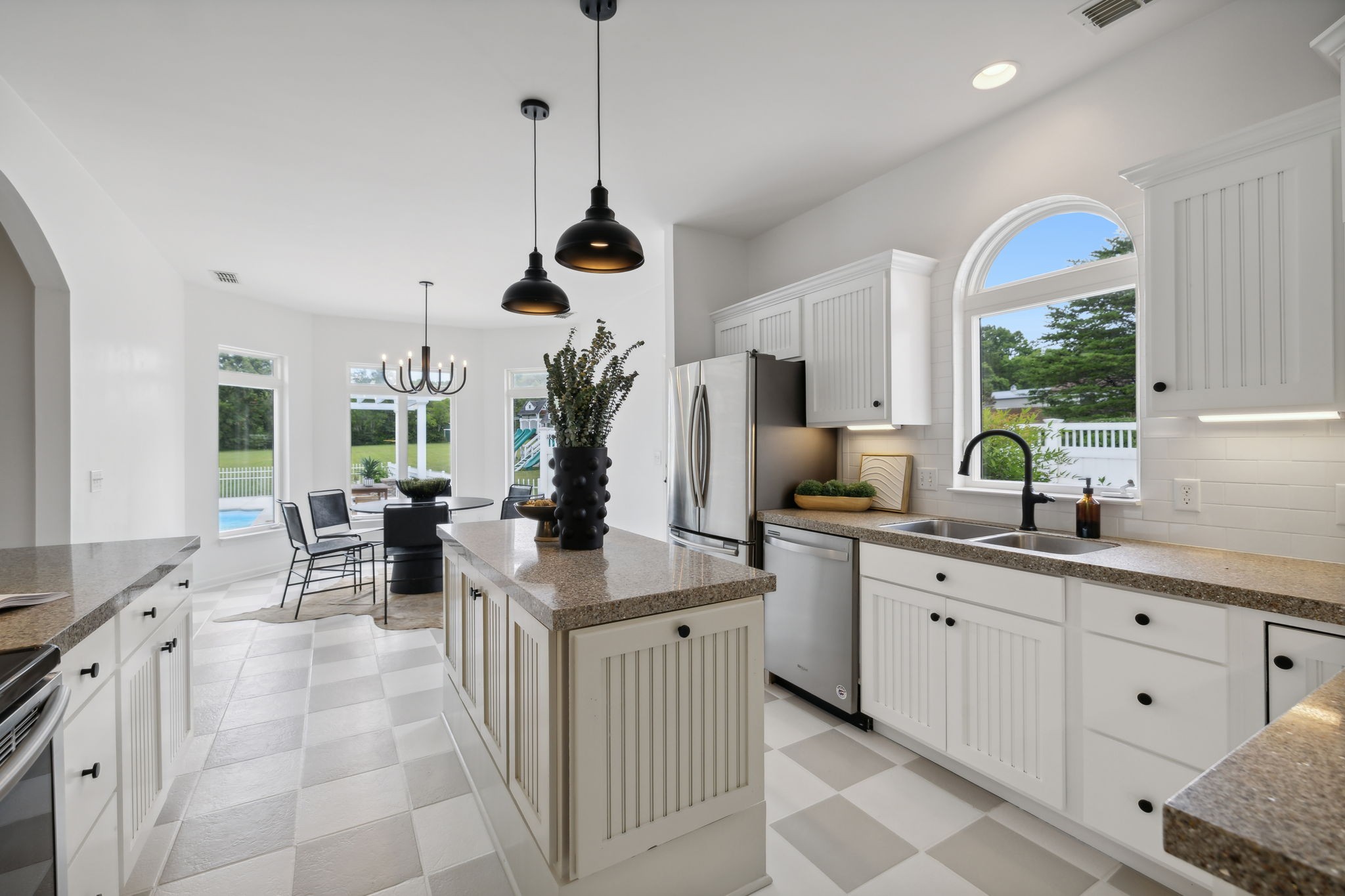 3084 Duplex Road Spring Hill, TN 37174 - Photo 11 of 53 a kitchen with stainless steel appliances a sink a counter top space and a center island