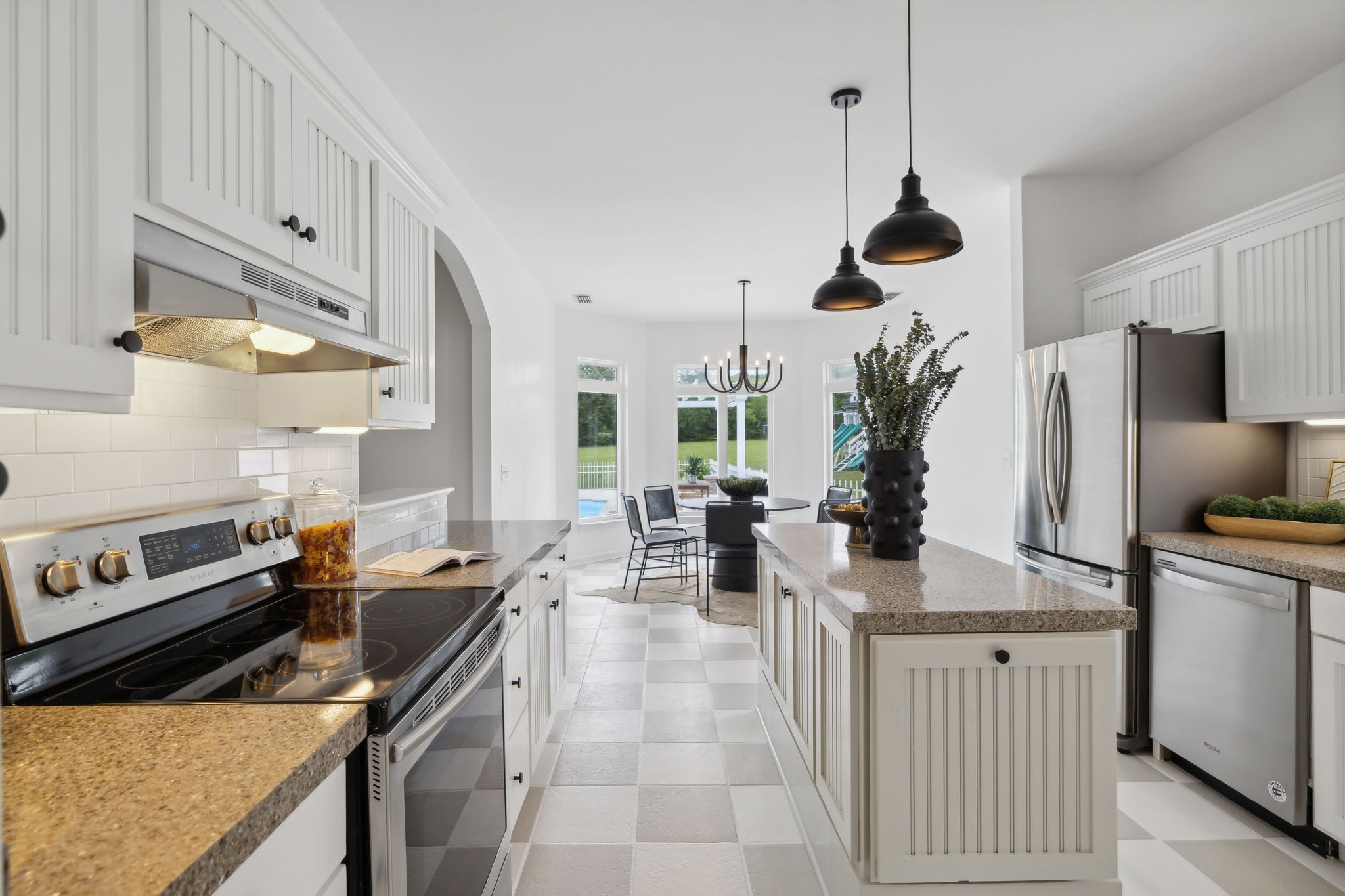 3084 Duplex Road Spring Hill, TN 37174 - Photo 12 of 53 a kitchen with stainless steel appliances granite countertop a sink a stove and a refrigerator