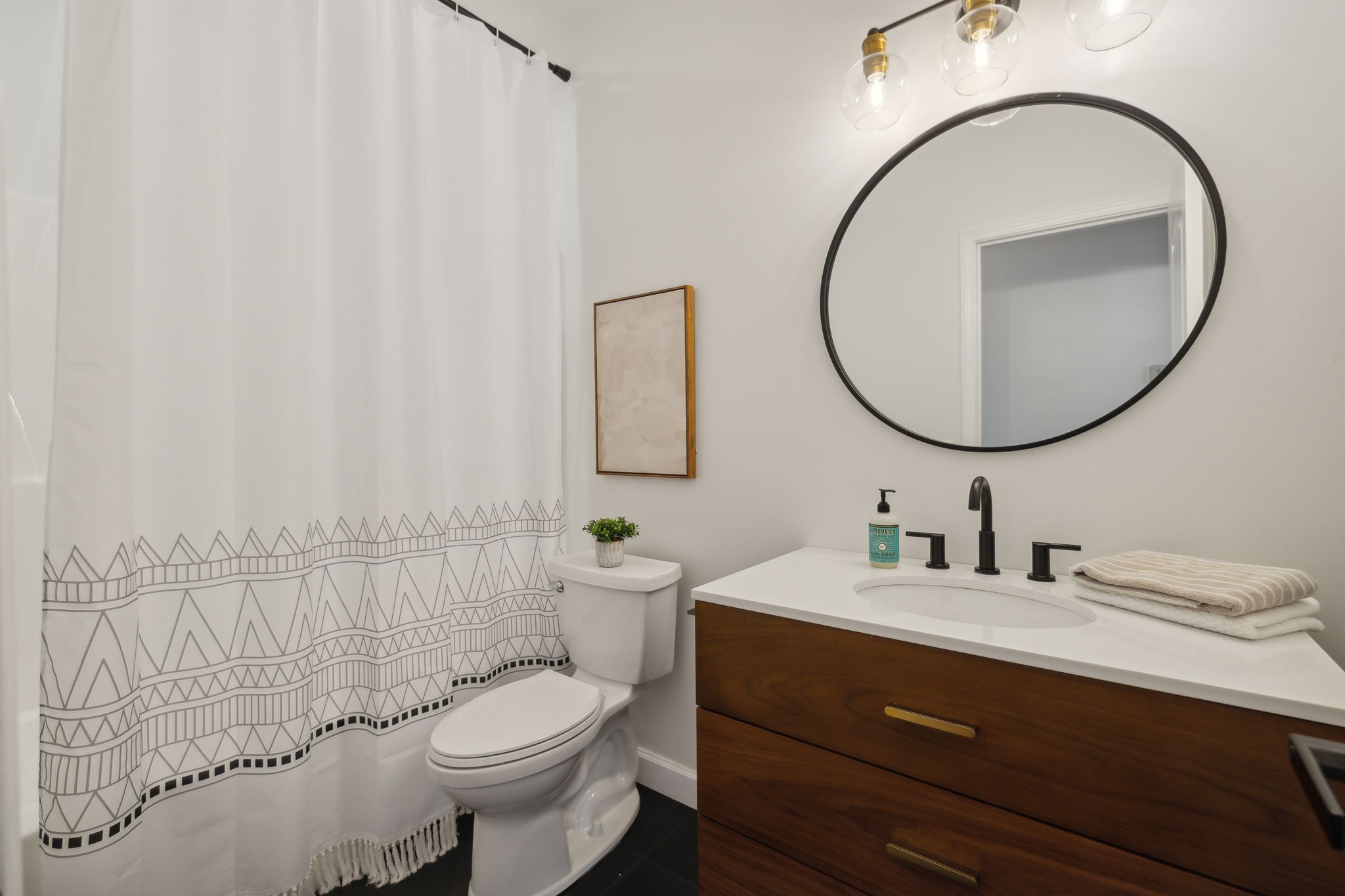 3084 Duplex Road Spring Hill, TN 37174 - Photo 27 of 53 a bathroom with a sink a toilet and a mirror