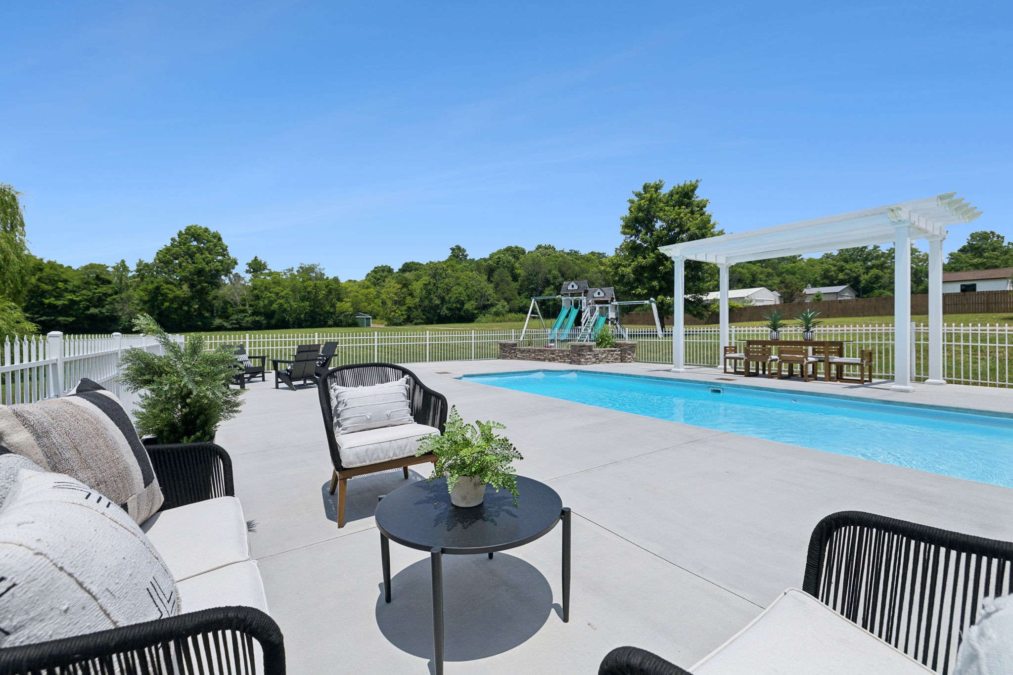 3084 Duplex Road Spring Hill, TN 37174 - Photo 34 of 53 a roof deck with table and chairs couches with wooden floor and fence