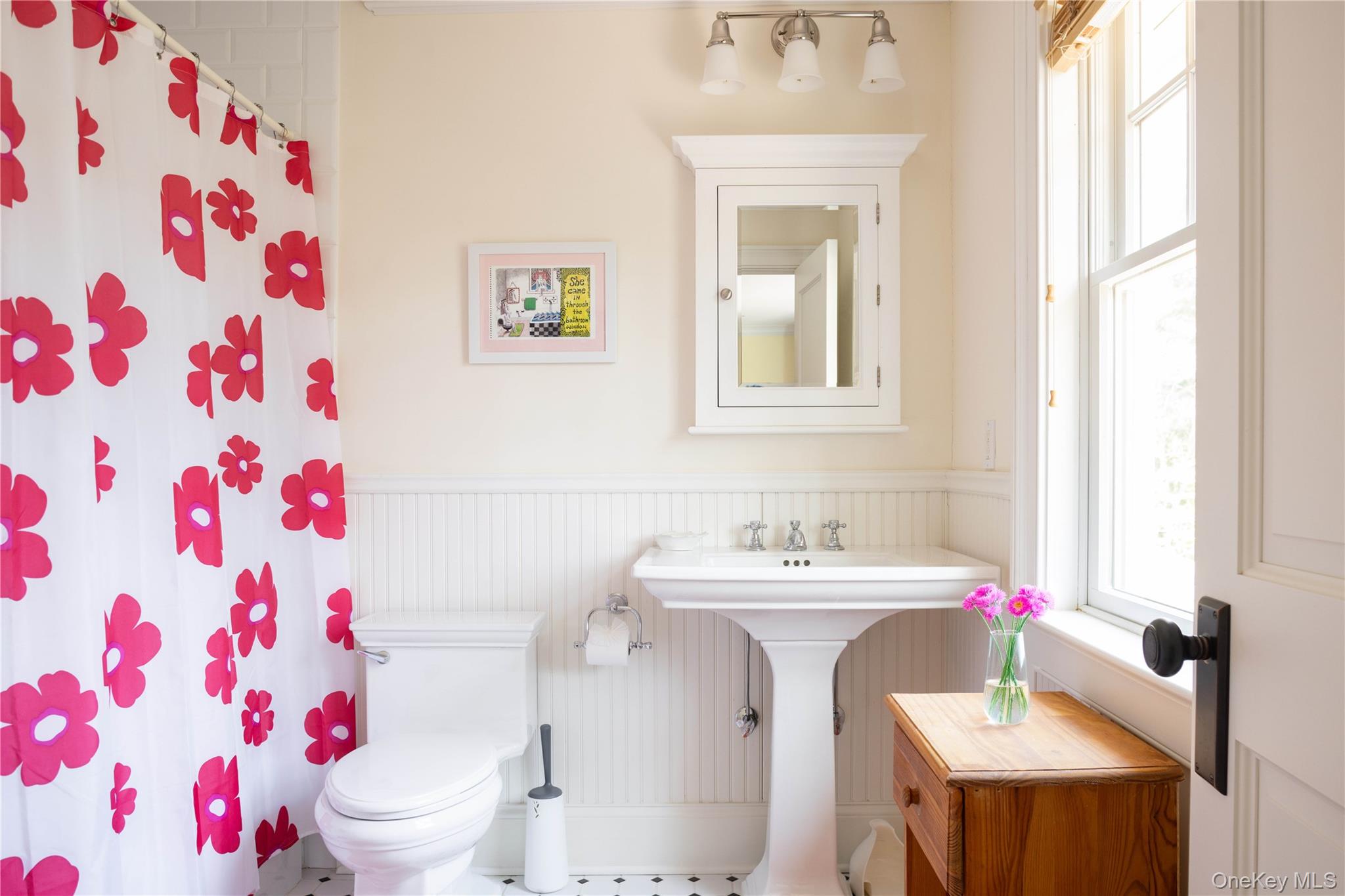 53 Cedar Lane West Remsenburg, NY 11960 - Photo 28 of 38 Full bathroom featuring a wainscoted wall, toilet, a shower with curtain, and a sink
