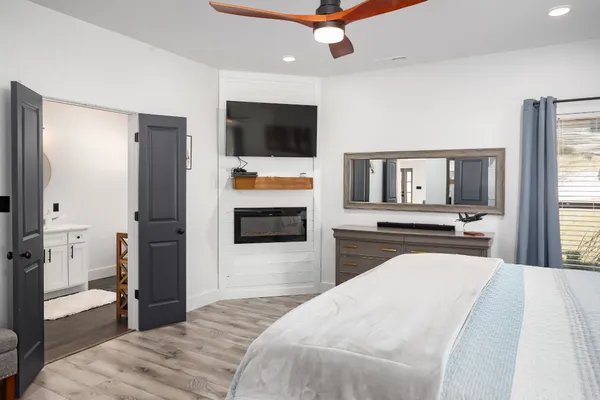 a bedroom with a bed and a television