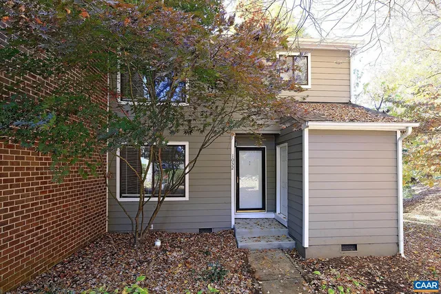 a view of a house with a tree