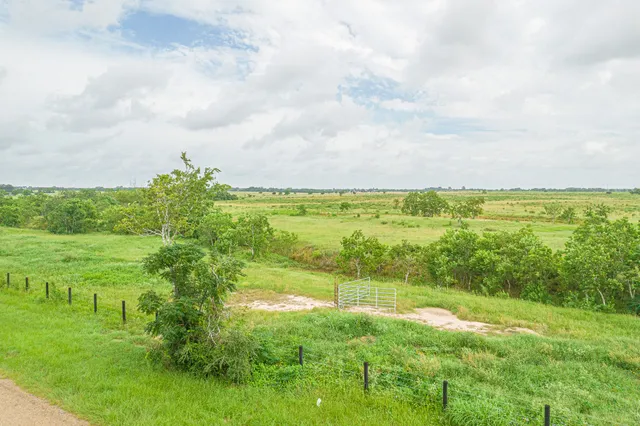 a view of a lake with a yard
