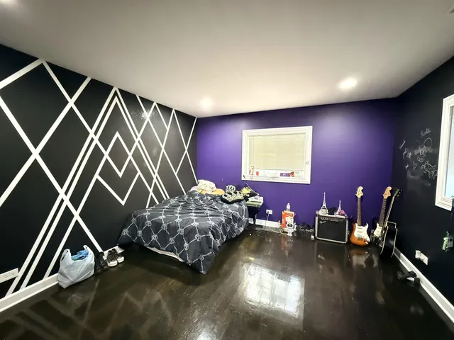 a bedroom with two beds and a tv