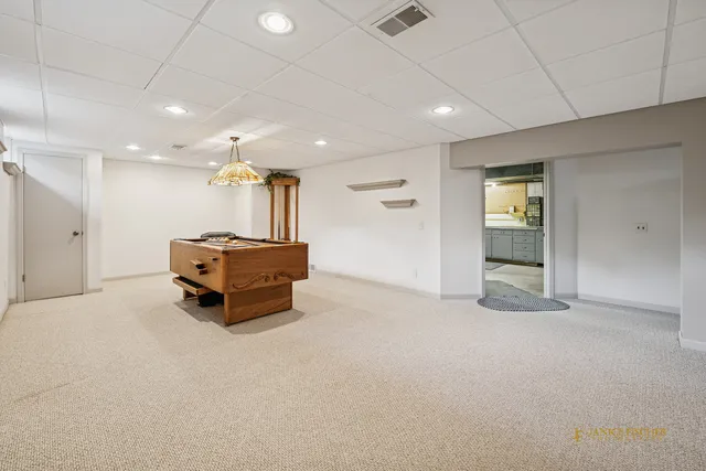 a kitchen with a sink cabinets and window