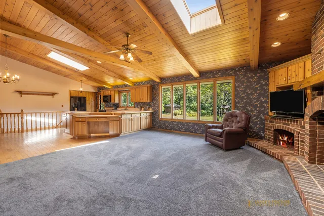 a view of a livingroom with furniture and a flat screen tv