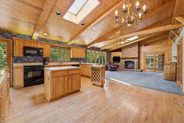 a kitchen with furniture a stove and a refrigerator