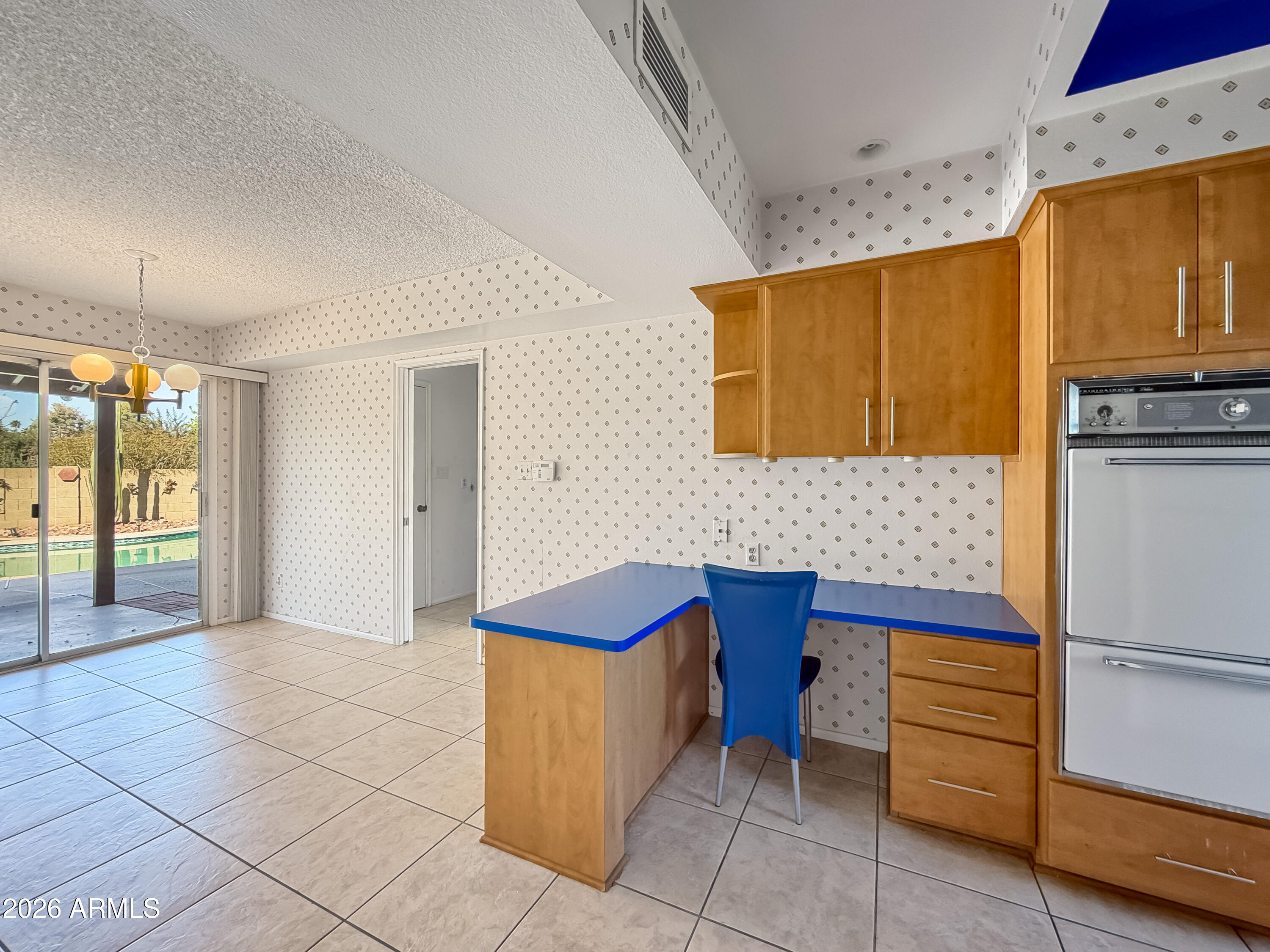 7848 North 5th Avenue Phoenix, AZ 85021 - Photo 11 of 28 a kitchen with stainless steel appliances granite countertop a sink and a stove