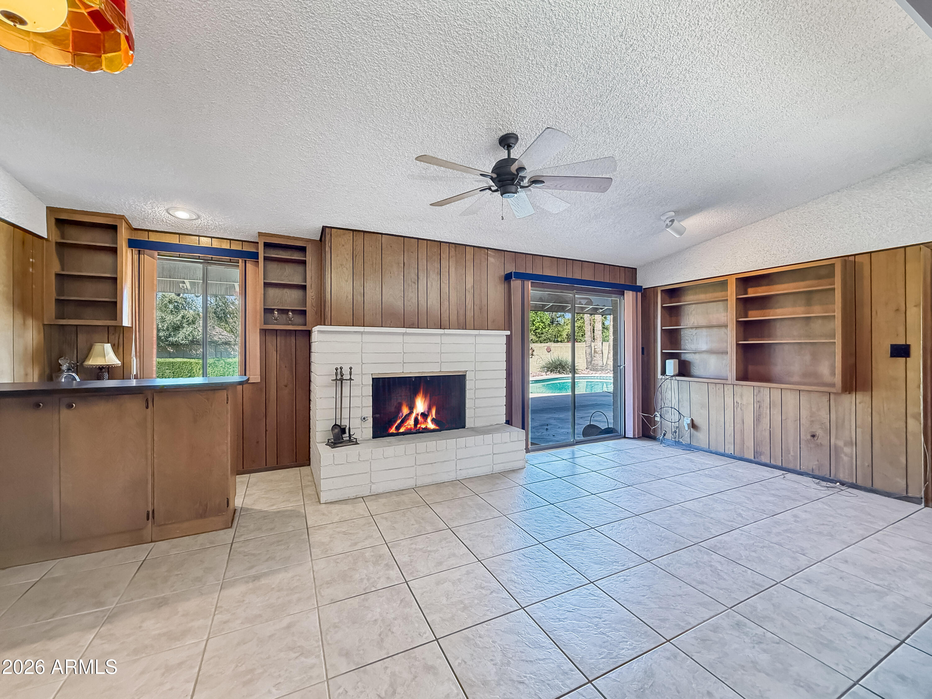 7848 North 5th Avenue Phoenix, AZ 85021 - Photo 14 of 28 a view of an empty room with a fireplace and a window