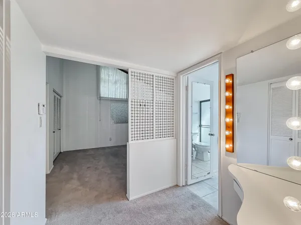 a view of a bathroom with toilet and shower