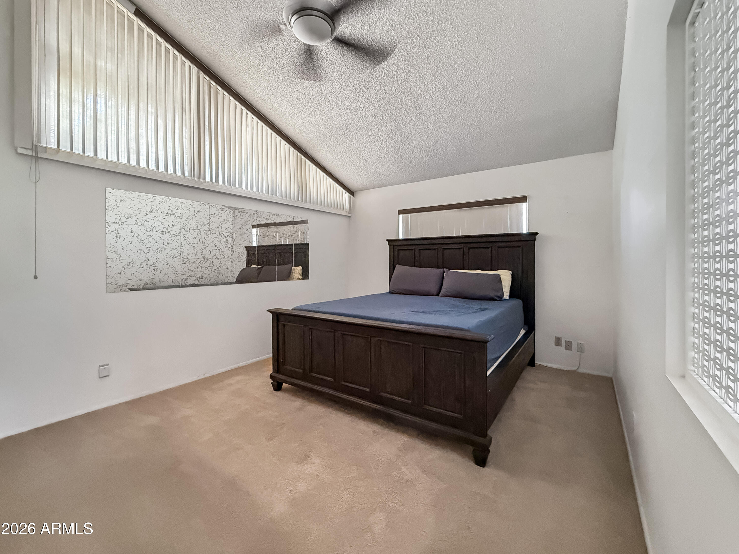 7848 North 5th Avenue Phoenix, AZ 85021 - Photo 16 of 28 a bedroom with a bed and a ceiling fan