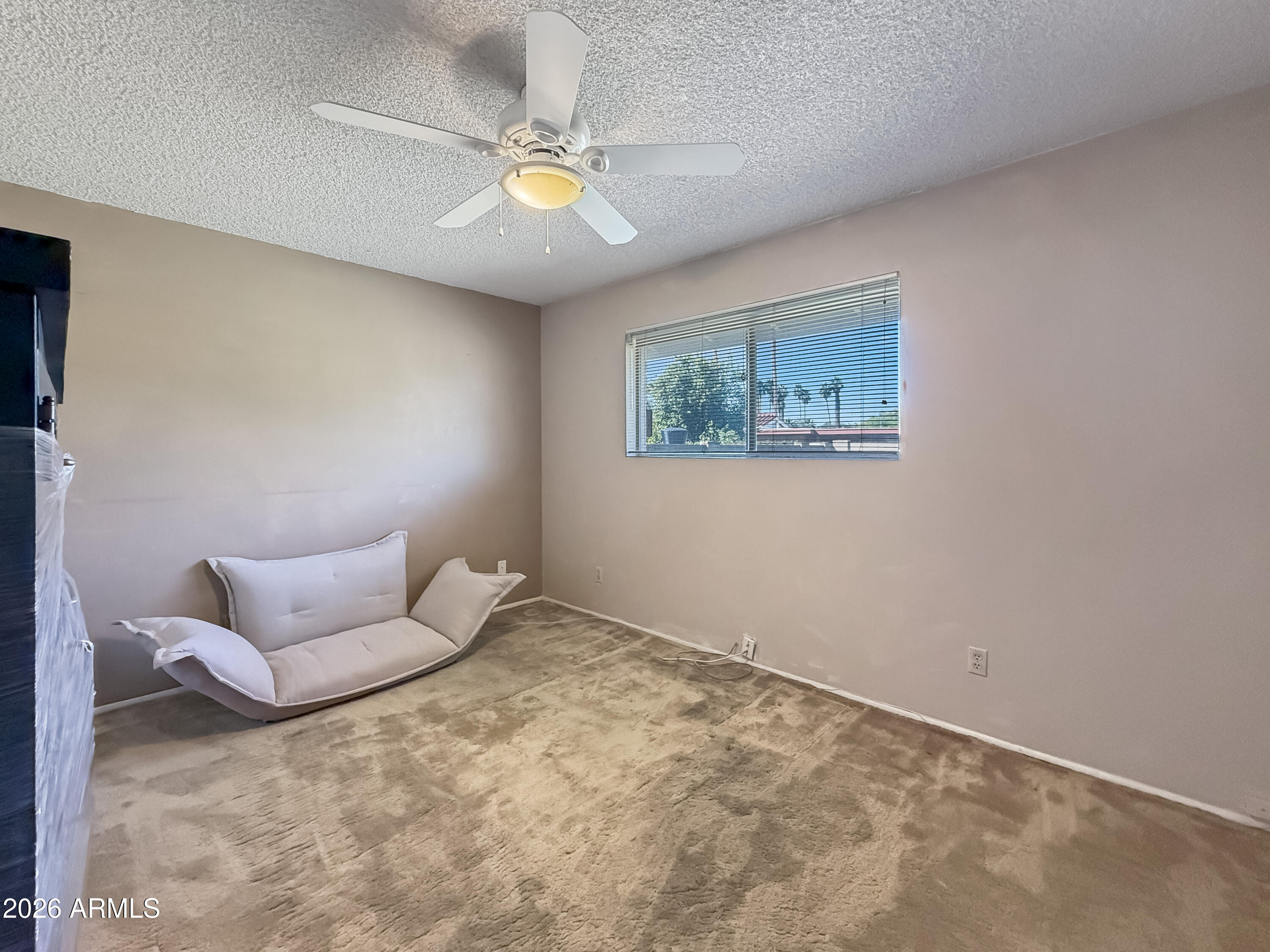 7848 North 5th Avenue Phoenix, AZ 85021 - Photo 19 of 28 a bedroom with a bed and painting on the wall