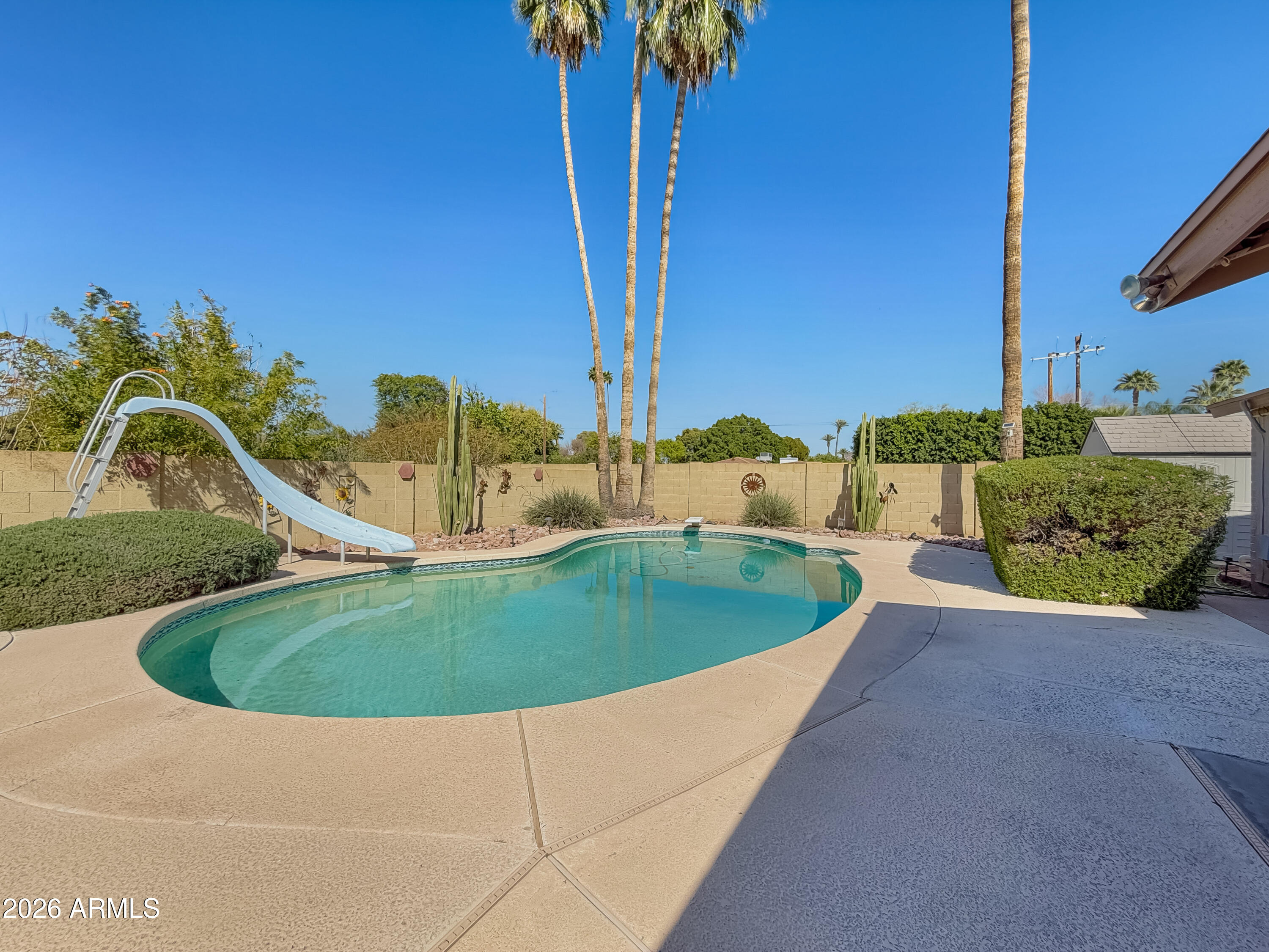 7848 North 5th Avenue Phoenix, AZ 85021 - Photo 24 of 28 a view of a swimming pool with a yard