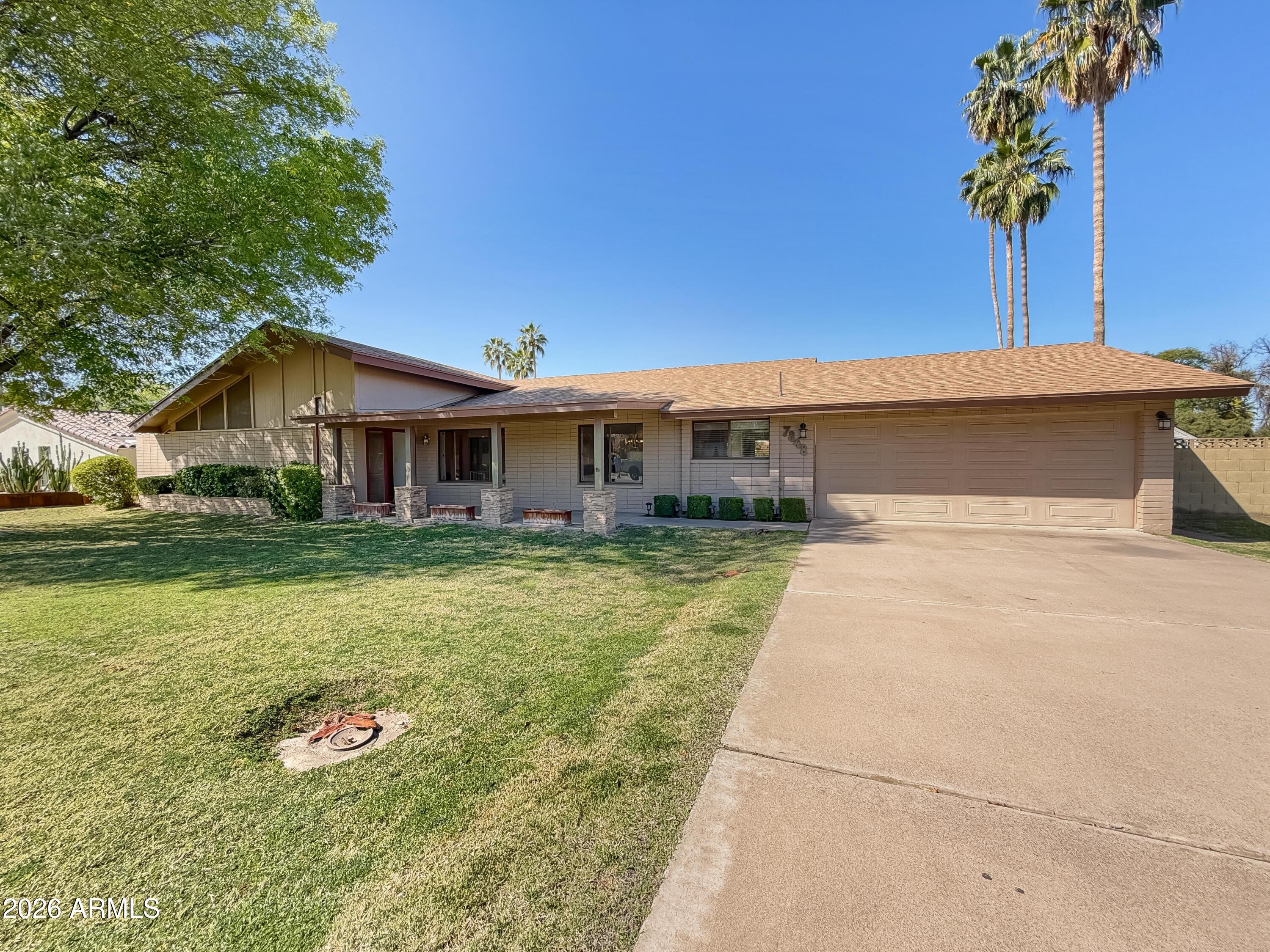 7848 North 5th Avenue Phoenix, AZ 85021 - Photo 26 of 28 a front view of a house with a yard