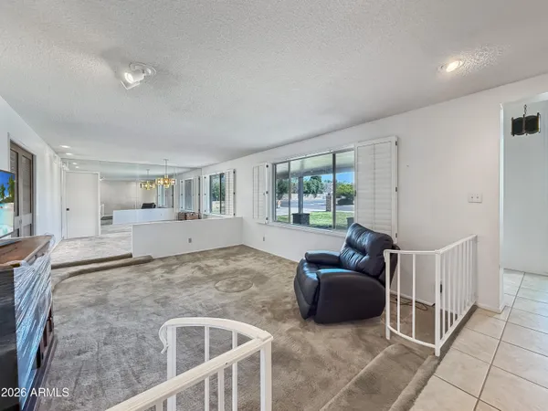a living room with furniture and a window