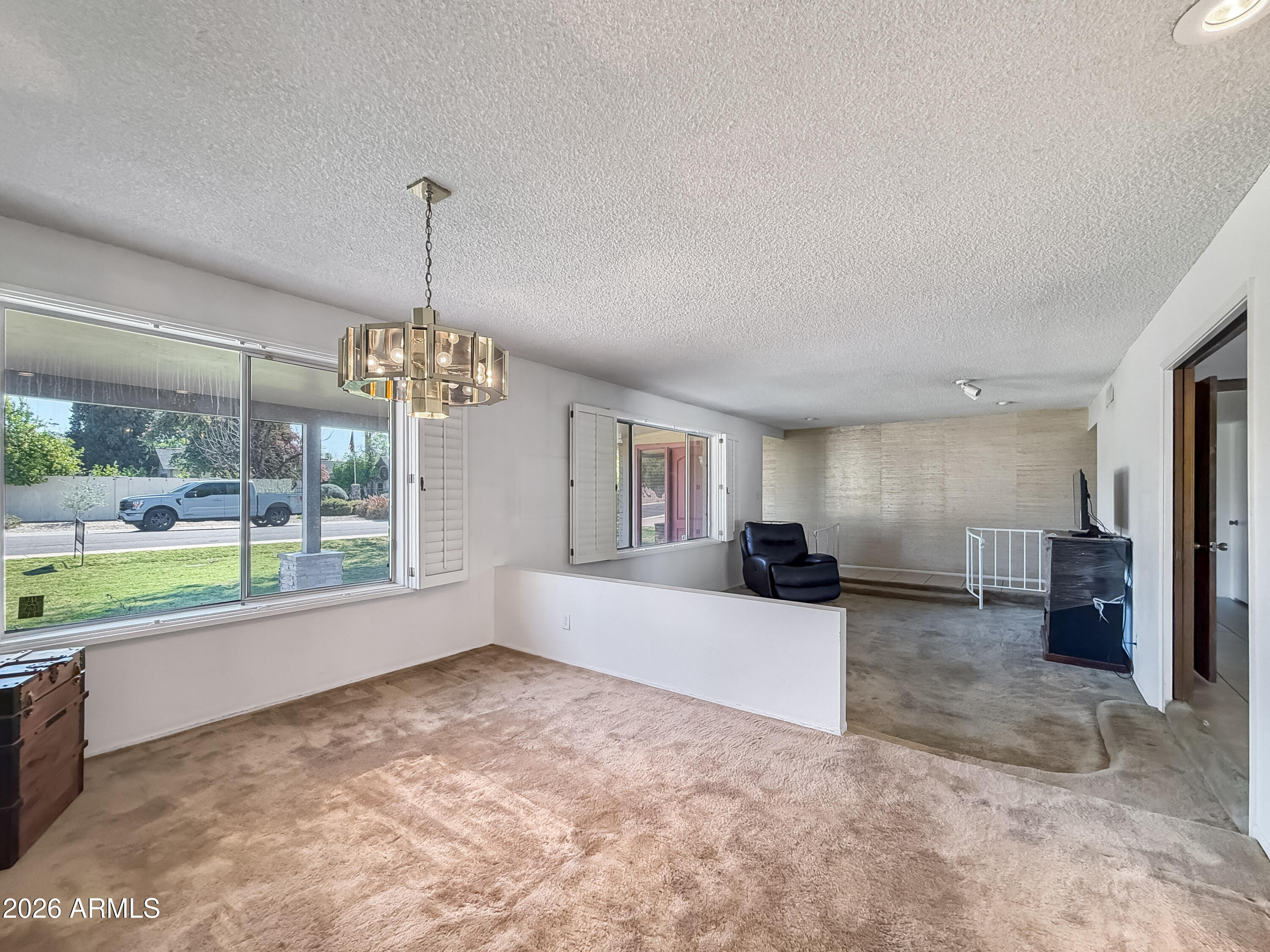 7848 North 5th Avenue Phoenix, AZ 85021 - Photo 7 of 28 a view of a livingroom with a kitchen and microwave