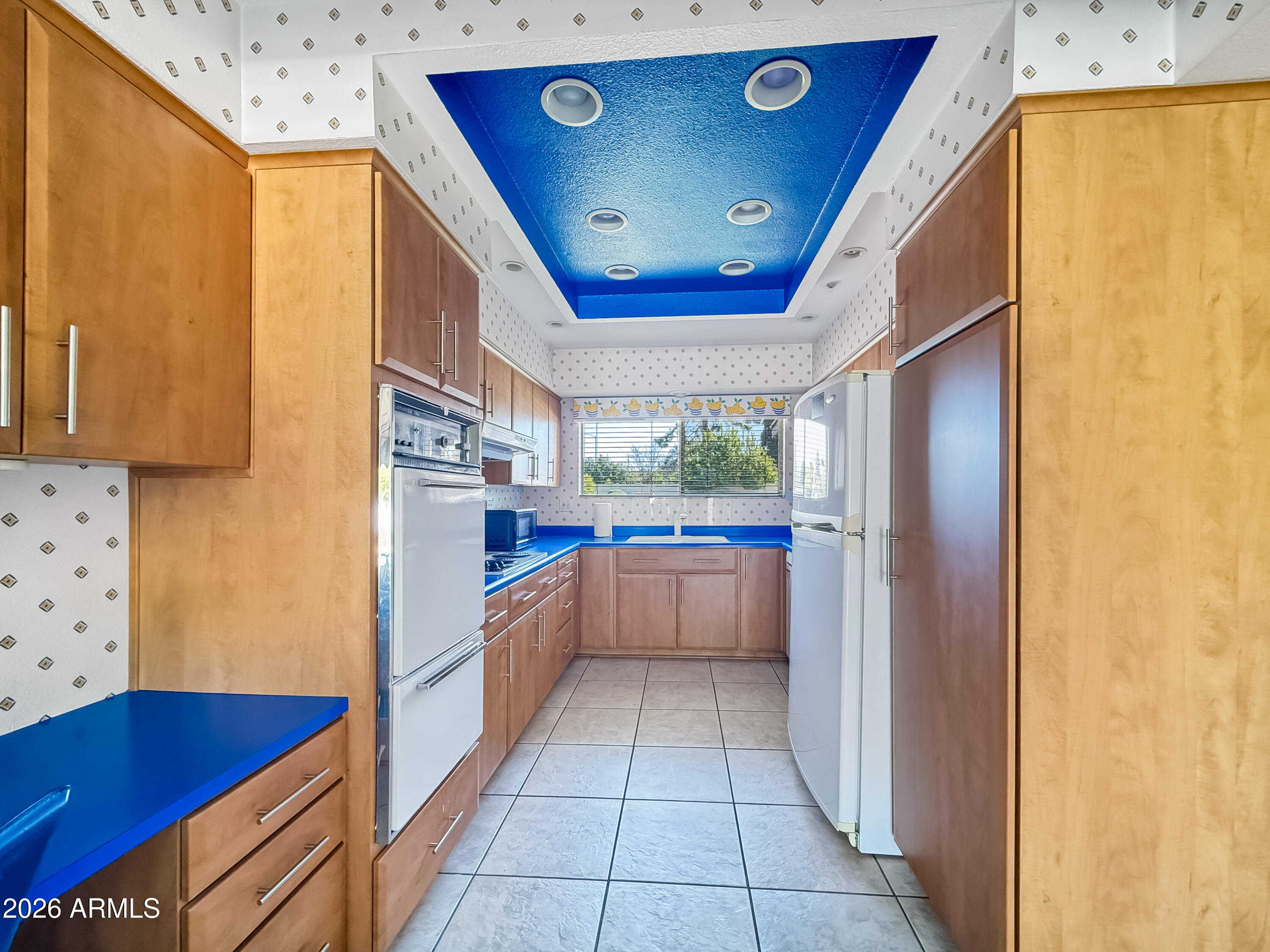 7848 North 5th Avenue Phoenix, AZ 85021 - Photo 9 of 28 a kitchen with stainless steel appliances granite countertop a refrigerator and a stove