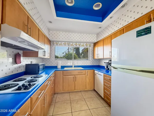 a kitchen with stainless steel appliances granite countertop a sink and cabinets