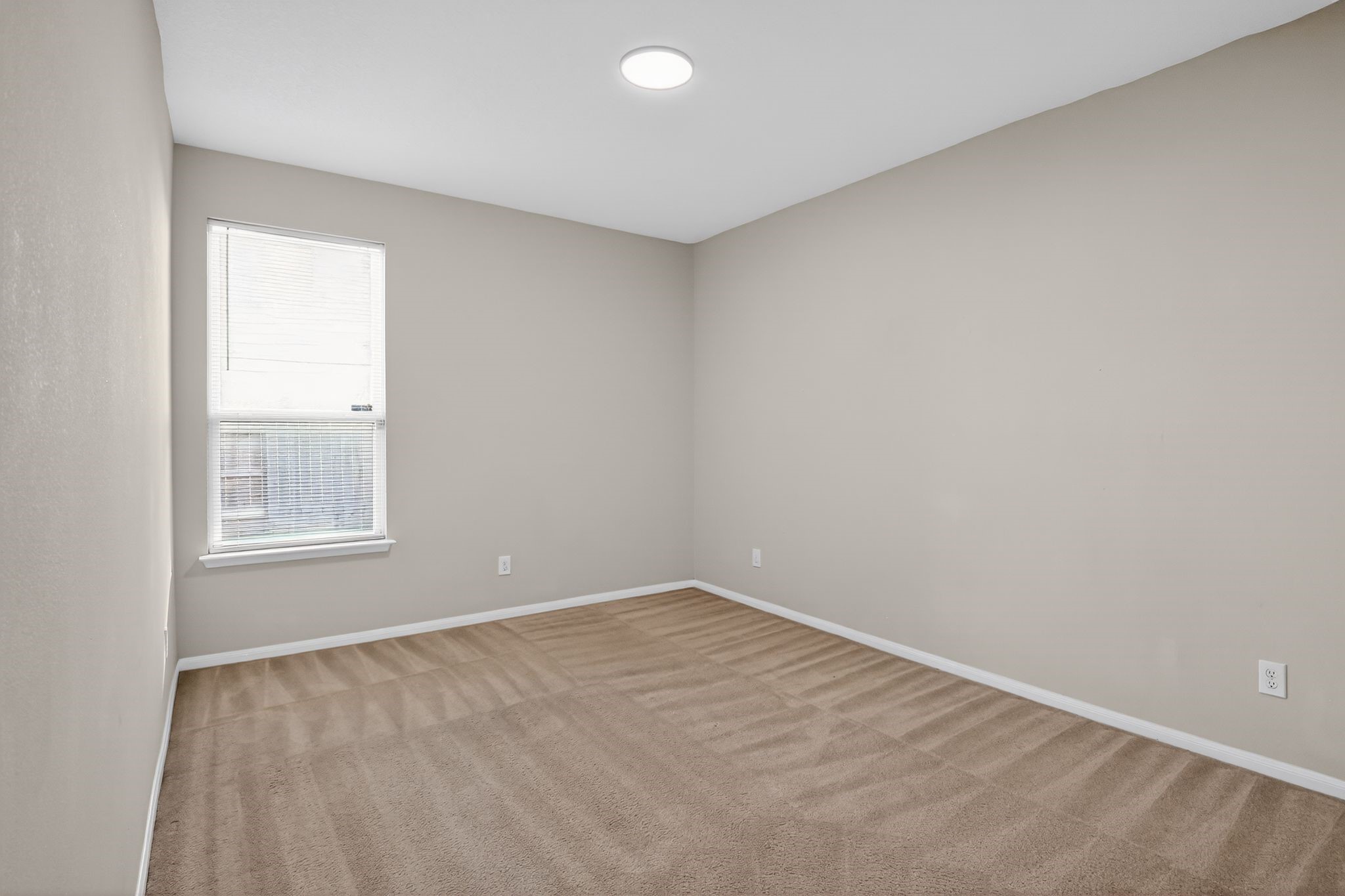 4938 Yearling Ridge Court Katy, TX 77449 - Photo 22 of 29 an empty room with a window