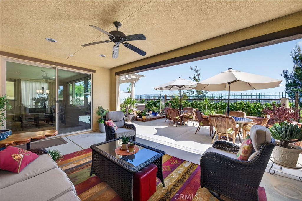 31749 Country View Road Temecula, CA 92591 - Photo 45 of 68 a living room with patio a couch and a table