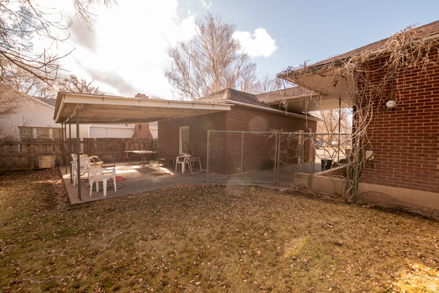 160 North 100 W Street Beaver, UT 84713 - Photo 9 of 36 Rear view of property featuring a patio area and brick siding