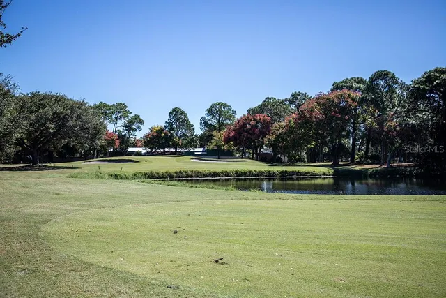 a view of a lake with houses in the background