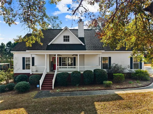a front view of a house with garden