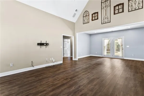 a kitchen with stainless steel appliances granite countertop a refrigerator a stove top oven a sink and dishwasher