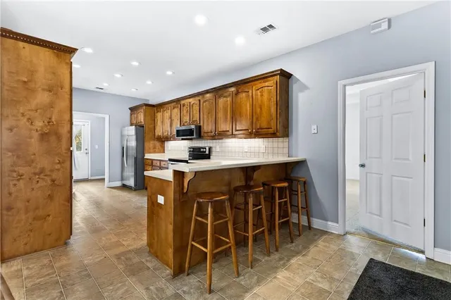 a large kitchen with a large window