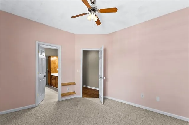 a view of a hallway with furniture and a livingroom view
