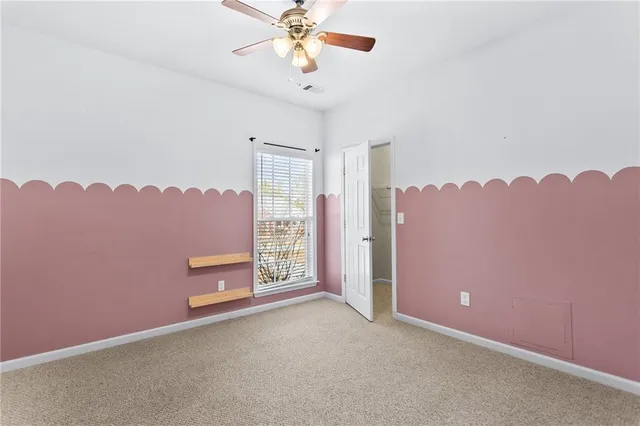 a view of a balcony with a floor to ceiling window and wooden floor
