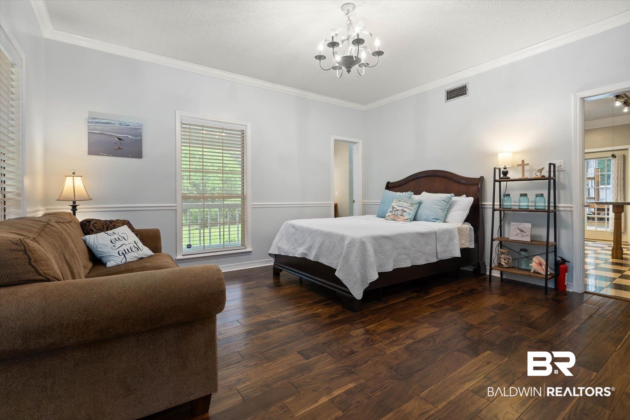 2300 Radcliff Road Saraland, AL 36571 - Photo 13 of 56 Bedroom featuring a chandelier, wood finished floors, and crown molding