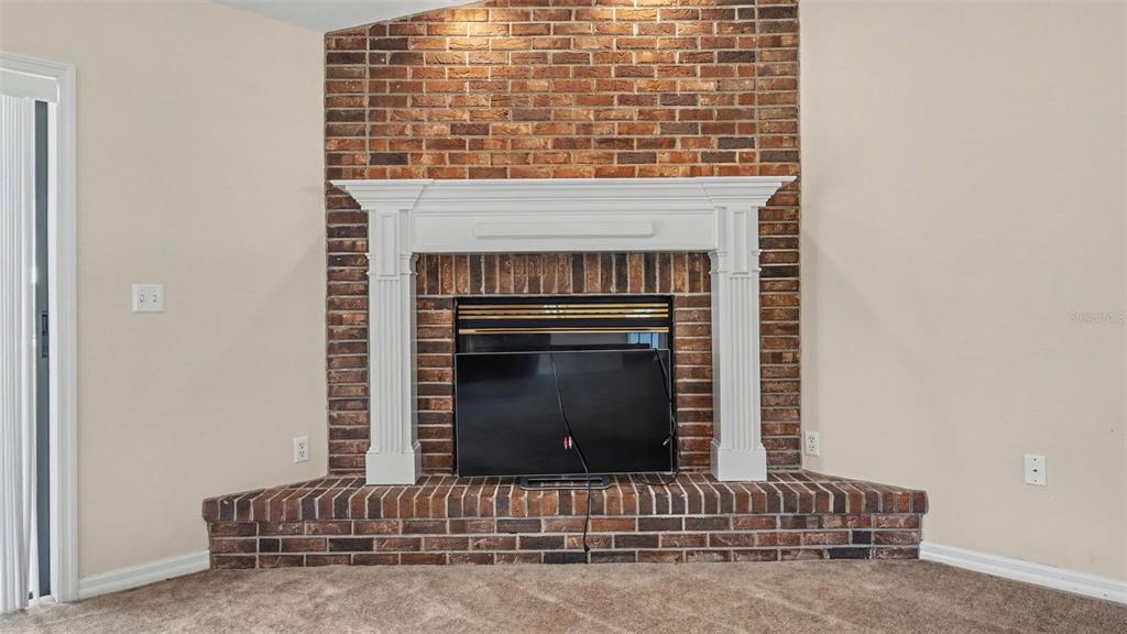 8525 North Campbell Road Lakeland, FL 33810 - Photo 35 of 45 a living room with fireplace