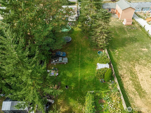 a view of house with backyard